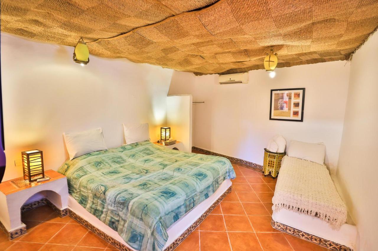 Riad Haj Palace & Spa Fez Exterior photo A bedroom in a cave house